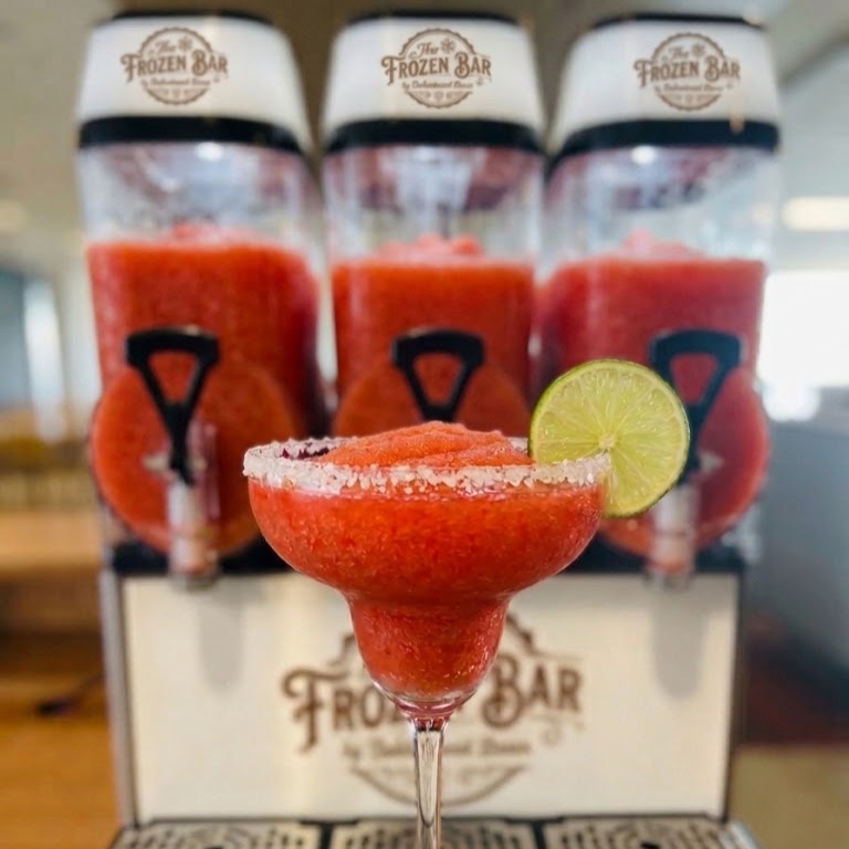 Frozen strawberry margarita poured from The Frozen Bar slush machine by Bubbles and Brews Canada