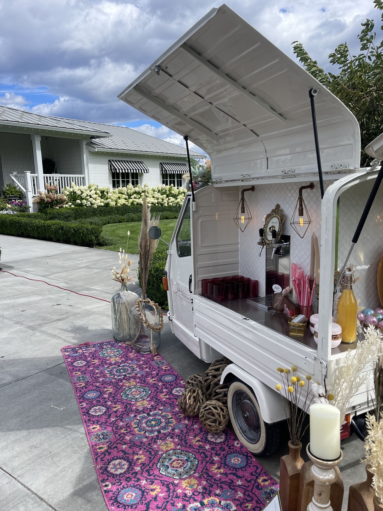 Prosecco bar parked in front of a modern farmhouse-style estate venue in Alberta